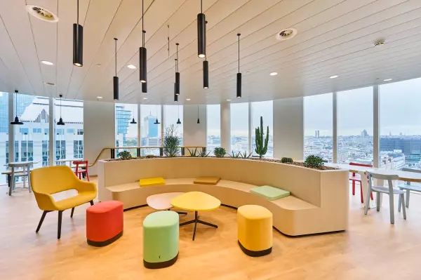 Office design and lounge area with colourful poufs and seat cushions